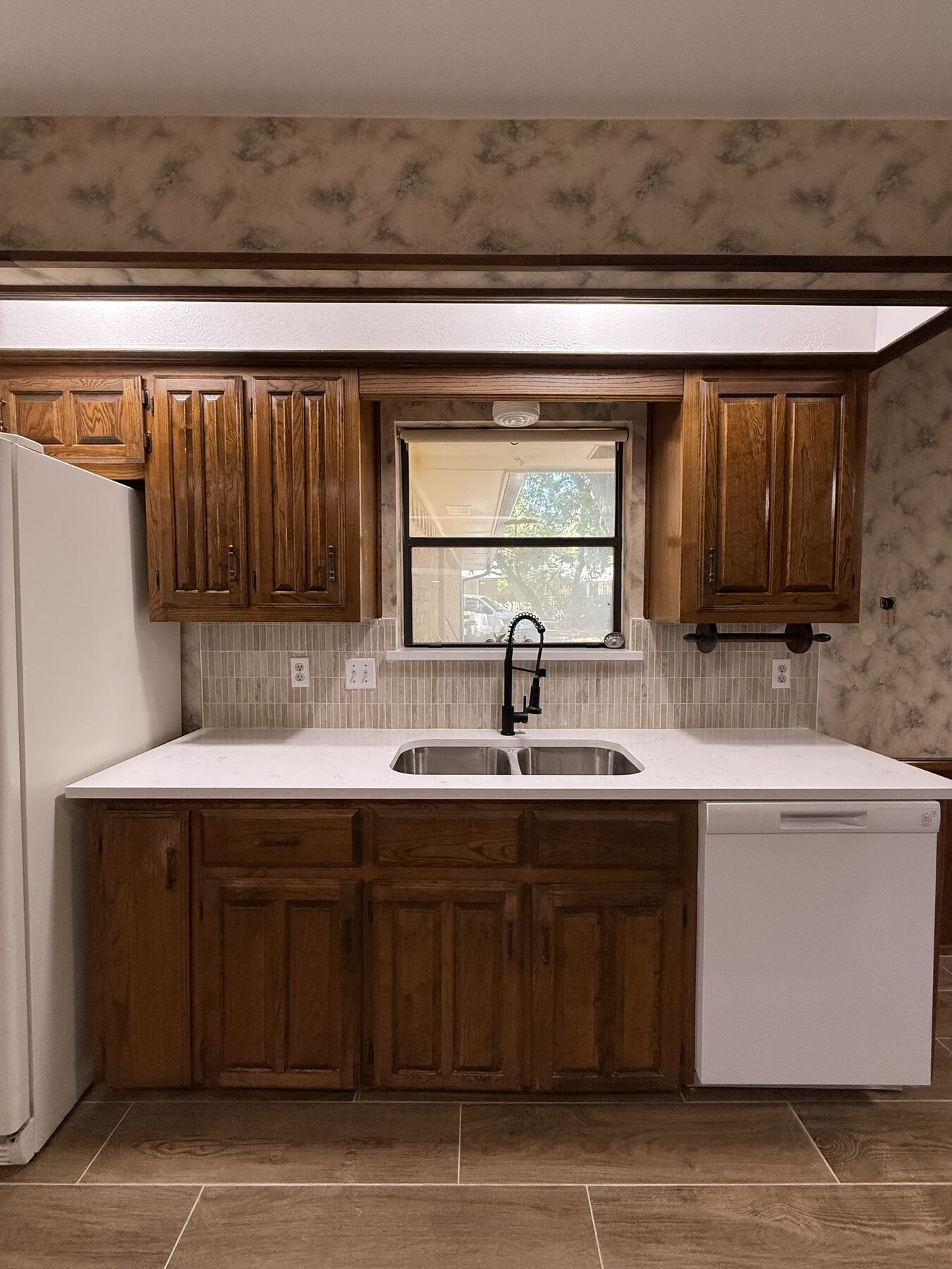 Kitchen sink wall after A&K's work